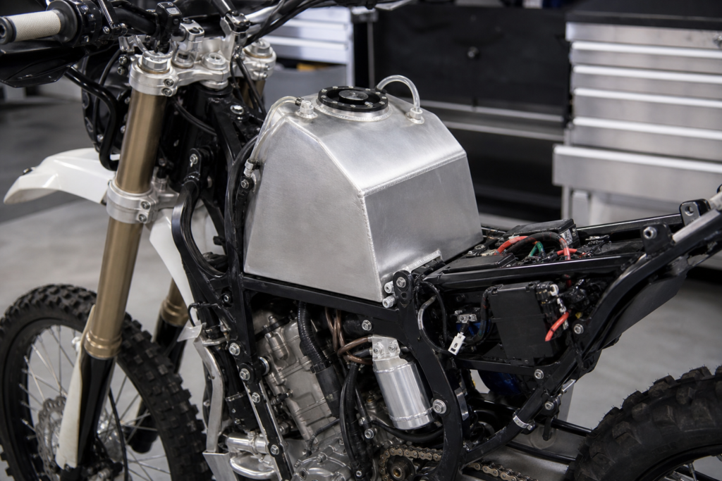 Custom aluminium fuel tank installed on an off-road motorcycle